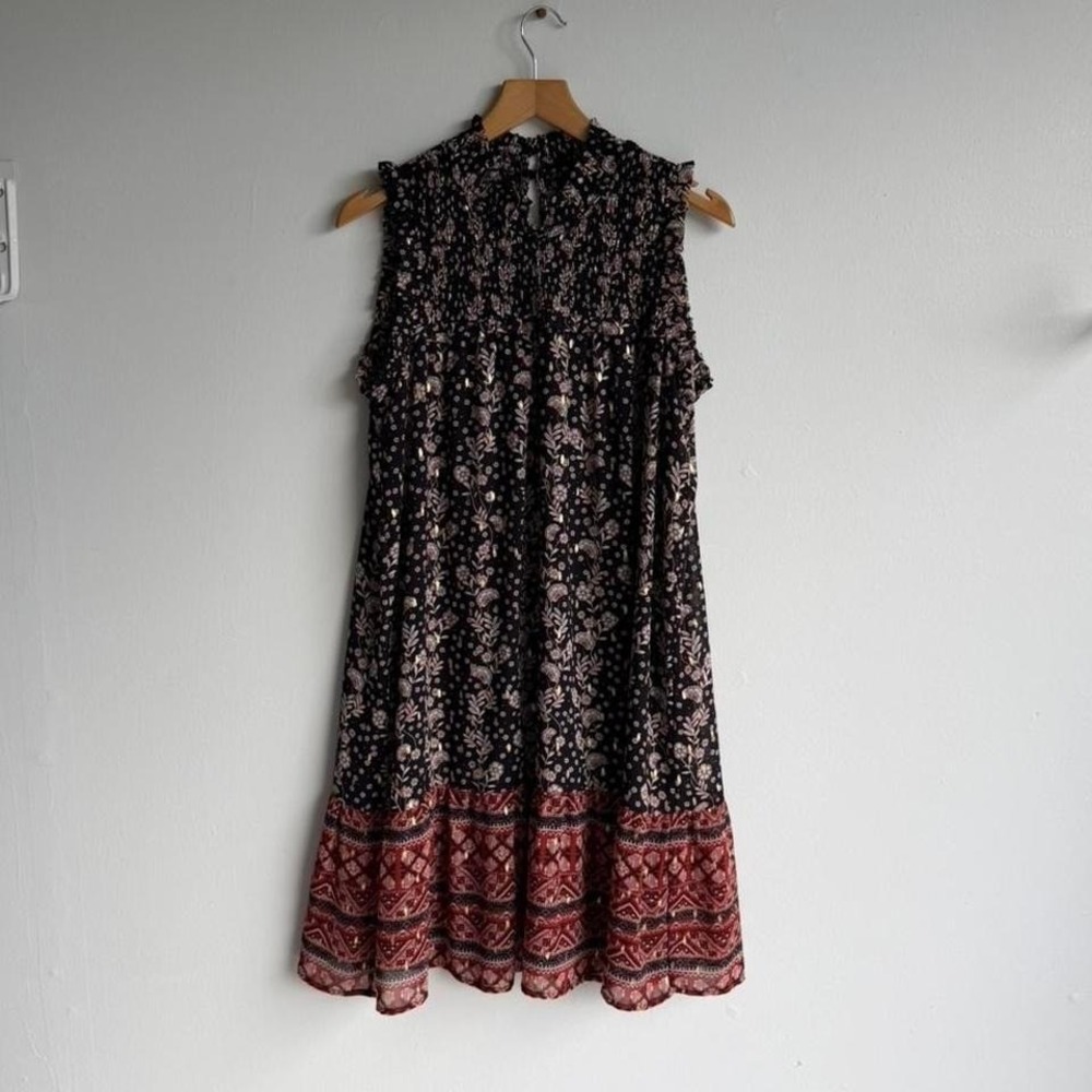 Black and red floral midi dress with ruffle hem and tie back detail.